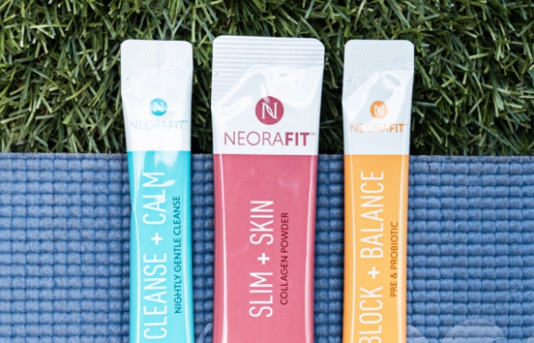 Lifestyle shot of sachets from the NeoraFit™ Weight Management & Wellness Set resting on a yoga mat.